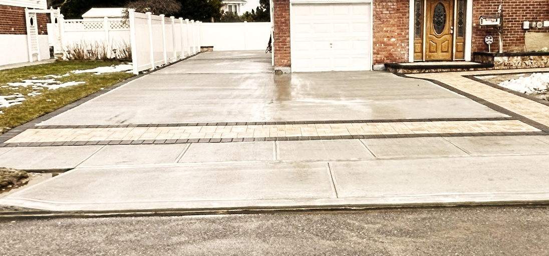 A custom paver driveway on Long Island, expertly installed by Constructive Greens, Corp.